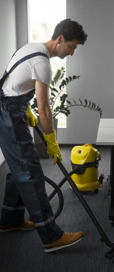 full-shot-man-cleaning-indoors